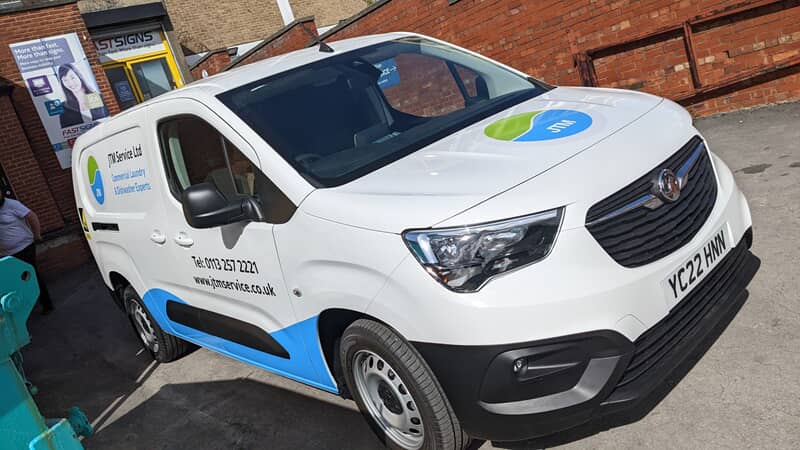 An image of the commercial laundry van graphics on a white van.
